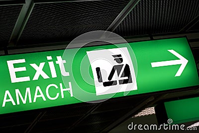 Green Exit sign in airport
