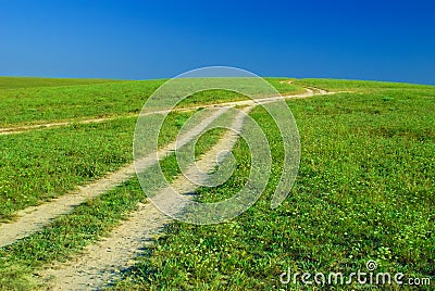 Green field, roads and sun sky