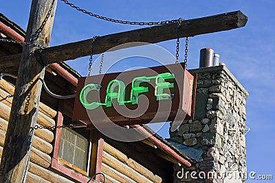 Green Neon Cafe Sign on Post