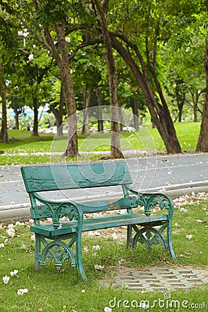 Green old chair in park