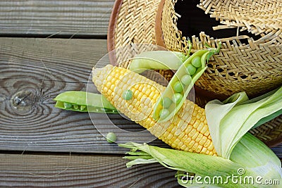 Green peas, corn, wheat and straw hat.