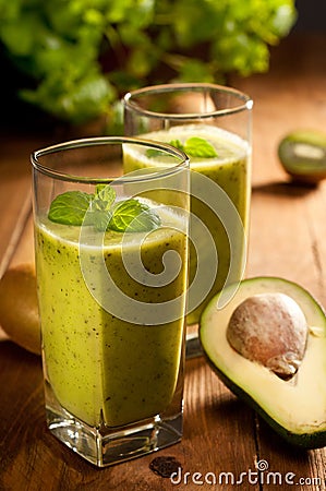 Green smoothie with avocado, kiwi, cucumber and mint