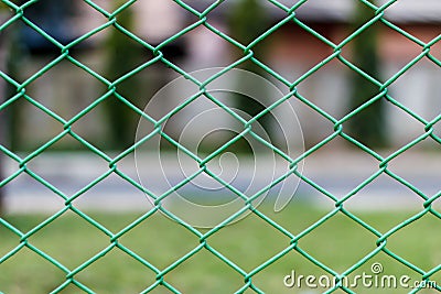Green steel wire chain link net fence photo stock with garden ba