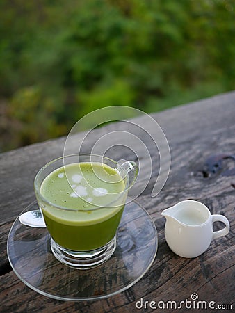 Green tea with milk jug