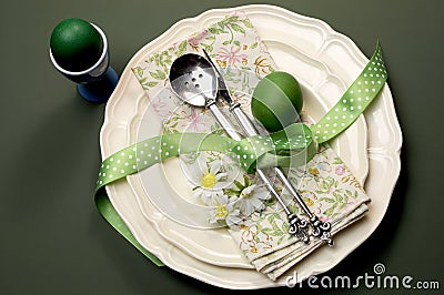Green theme Happy Easter dinner or breakfast table setting