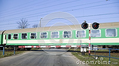 Green train crossing.