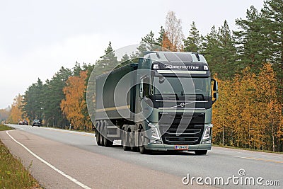 Green Volvo FH Semi Truck on the Road in Autumn