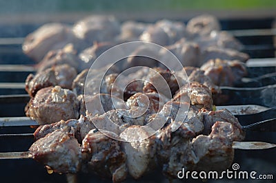 Grill meat on skewers outside the room