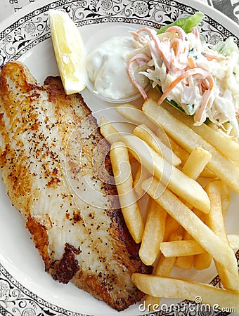 Grilled fish with fries and coleslaw