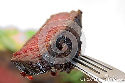 Grilled strip steak with tomato and salad