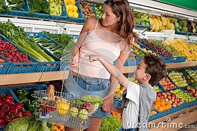 Grocery store - Woman with child buying vegetable