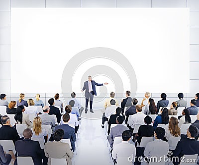 Group Of Business People Listening To A Speech