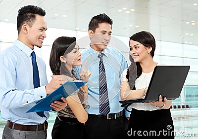 Group of business people meeting with laptop