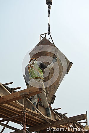 Group of construction workers casting beam
