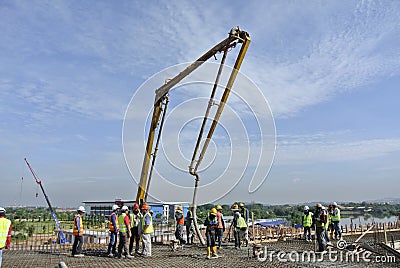 Group of Construction Workers and Concrete Pump
