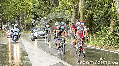 Group of Cyclists in a Rainy Day