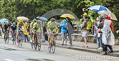 Group of Cyclists Riding in the Rain