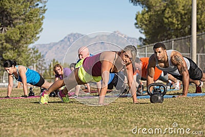 Group Doing Push-Ups with Instructor