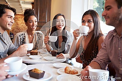 Group Of Female Friends Meeting In Cafe Restaurant