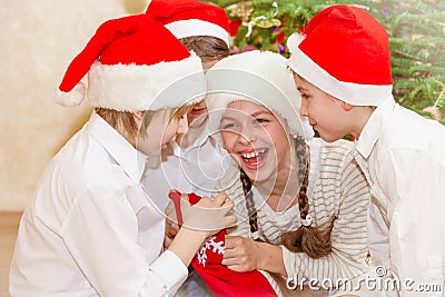 Group of four children in Christmas hat