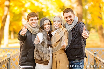 Group of friends having fun in autumn park