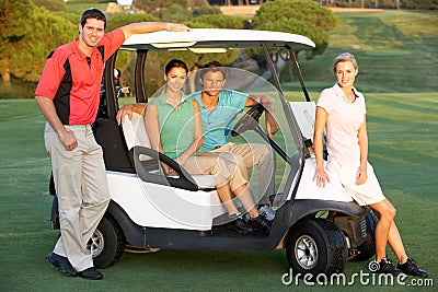 Group Of Friends Riding In Golf Buggy