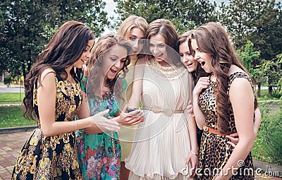 Group of girls looking at a cell phone