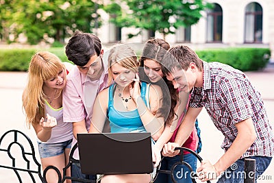 Group of happy smiling Teenage Students Outside College