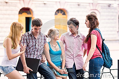 Group of happy smiling Teenage Students Outside College