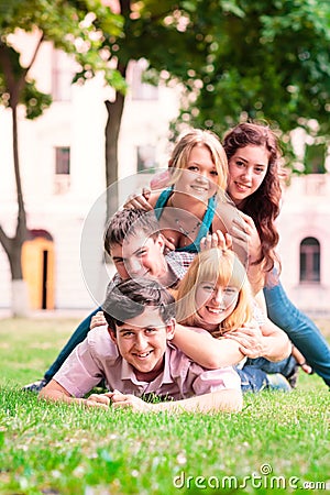 Group of happy smiling Teenage Students Outside