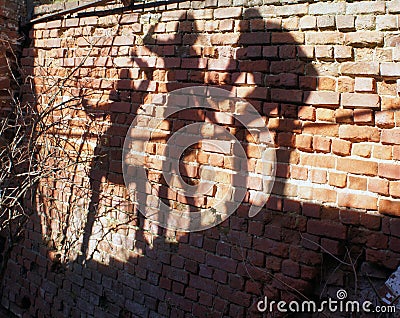 Group of human Shadows on the brick wall