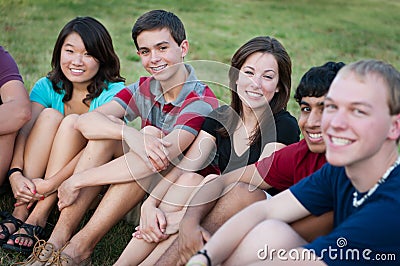 Group of Multi-ethnic happy teenagers outside