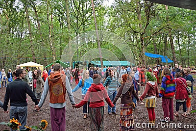 Group of people holding hands in a circle, harmony