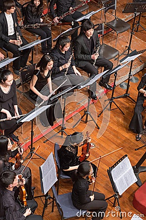 Group of people playing in a classical music concert, china