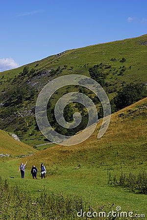 Group of people walking in hills