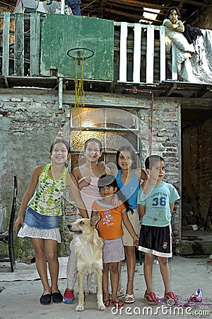 Group portrait of children with pet, Argentina