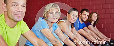 Group riding bikes in health club