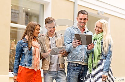 Group of smiling friends with tablet pc computers