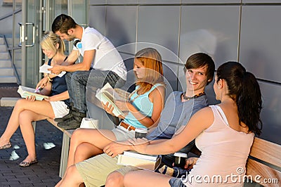 Group of students with books hanging out