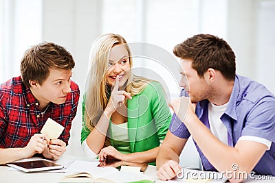 Group of students gossiping at school