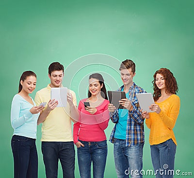 Group of teenagers with smartphones and tablet pc