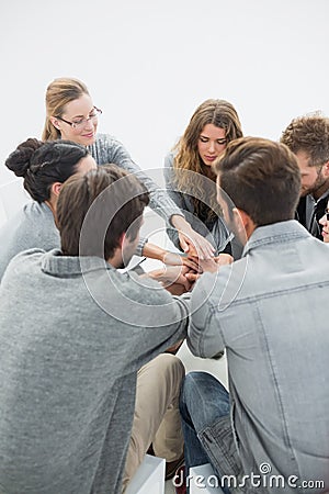 Group therapy in session sitting in a circle