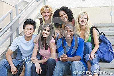 Group of university students sitting on steps