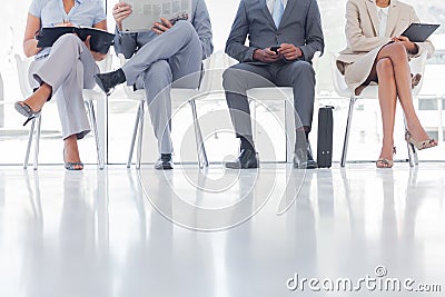 Group of well dressed business people waiting