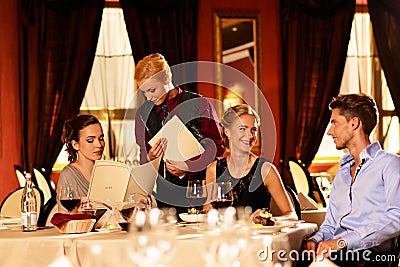 Group of young friends in restaurant