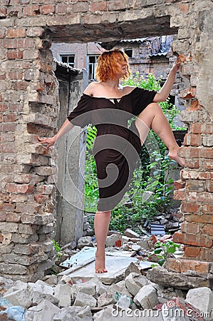 Grunge portrait of a woman in urban ruins