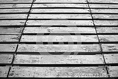 Grunge wooden black and white boards floor background.