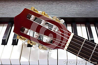 Guitar neck on piano keys