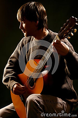 Guitar playing. Classical guitarist professional