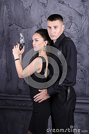 Guy and a girl with a gun